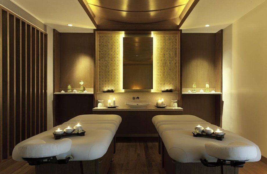 Serene spa treatment room with massage table and calming ambiance